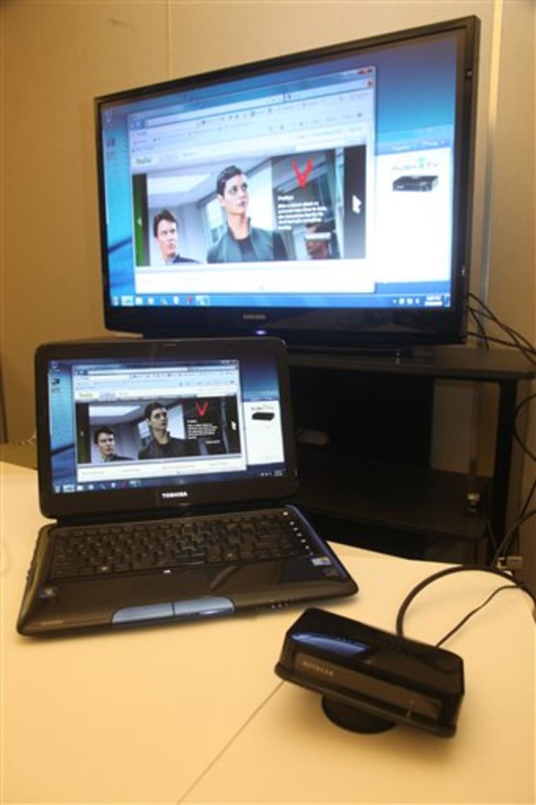 A Netgear box, right, connects the laptop computer to a television set. The biggest hurdle for Wireless Display is that you need a new laptop to use it, and the laptops are relatively big, heavy models that cost around $1,000.